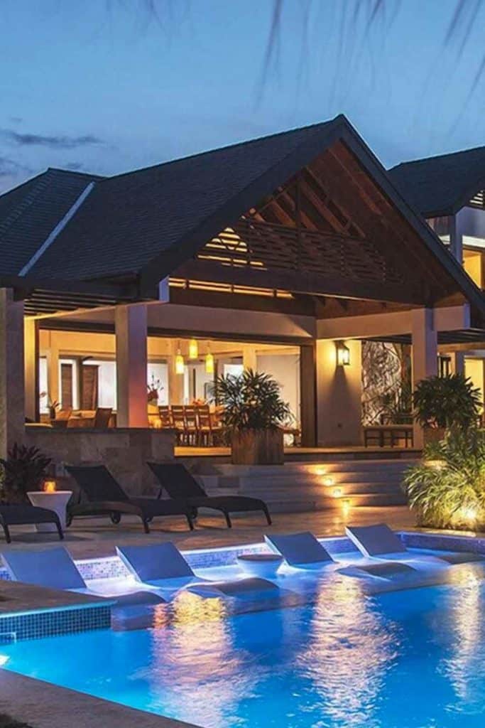 Tropical houses in jamaica at night pool