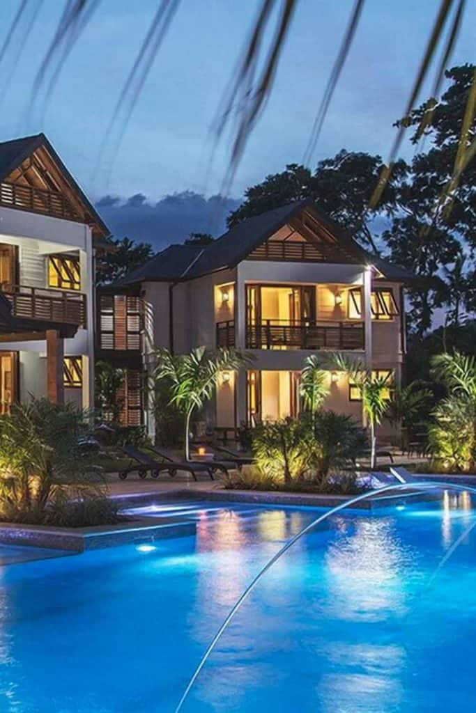 Tropical houses in jamaica at night with pool